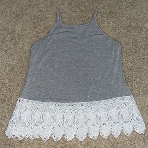 Gray tank top with white lace at the bottom